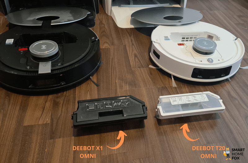 Die beiden mobilen Staubbehälter des DEEBOT X1 OMNI und T20 OMNI stehen nebeneinander.